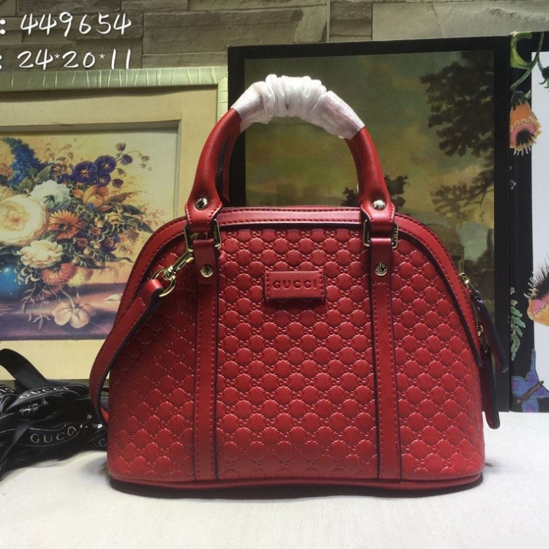 G*u*i top handle bags